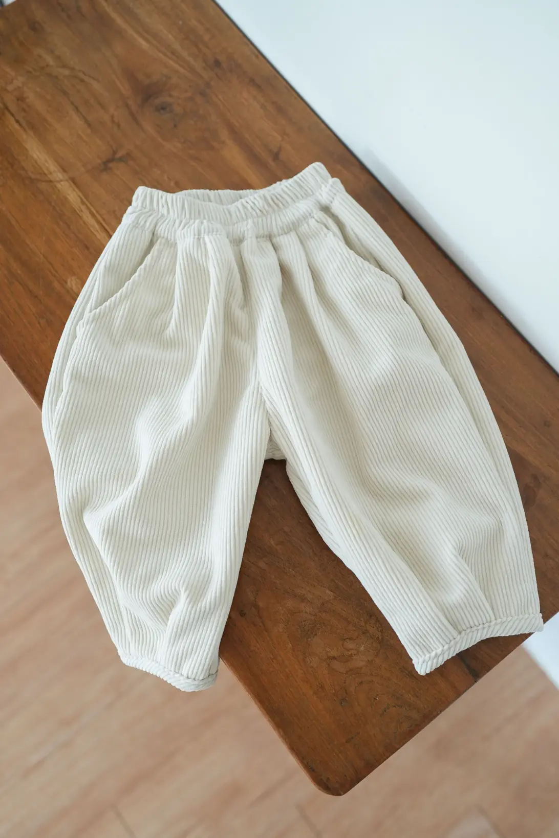 Cream corduroy kids pants with elasticated waist and relaxed fit