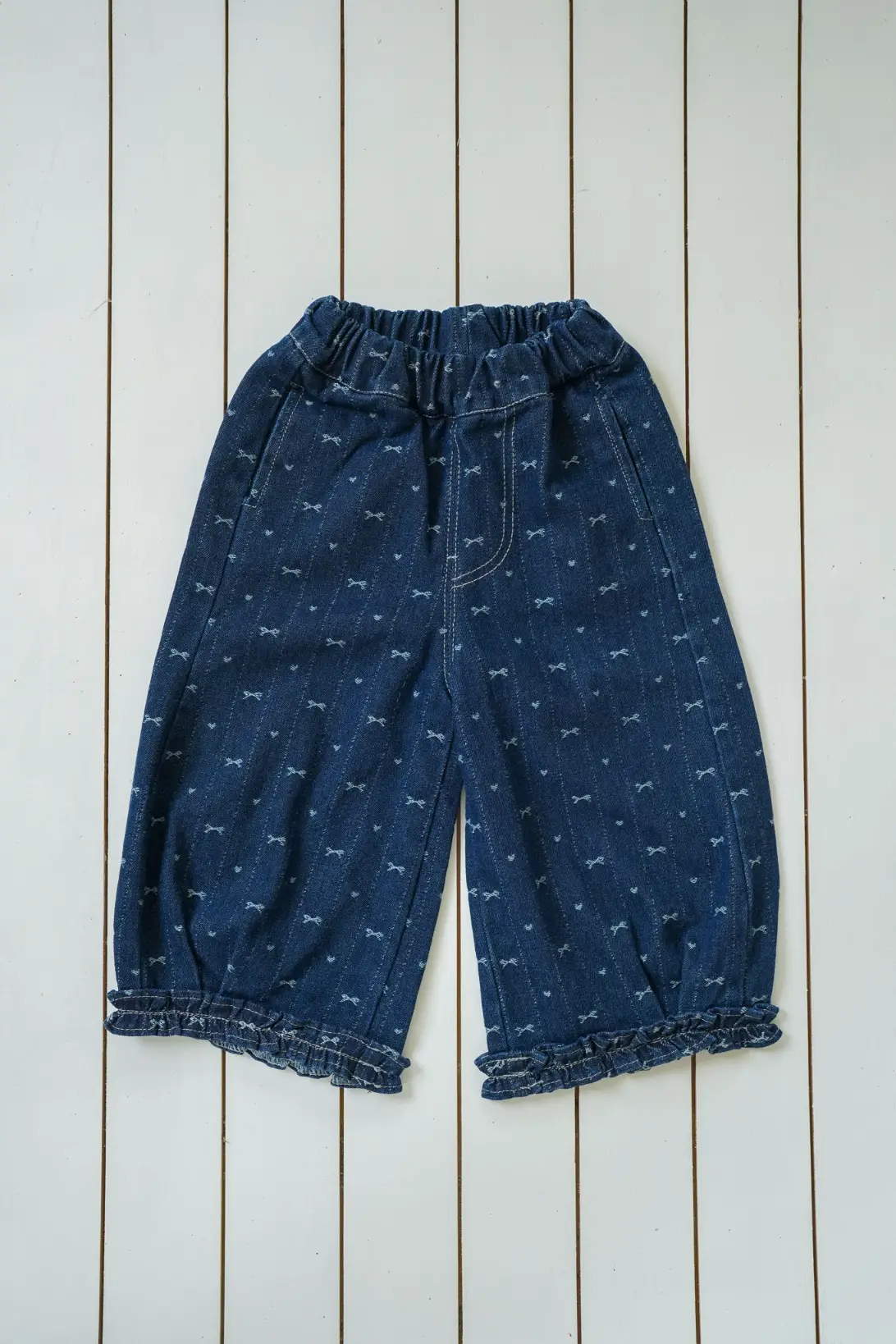Bow Denim Jeans for girls with delicate bow print and ruffled cuffs