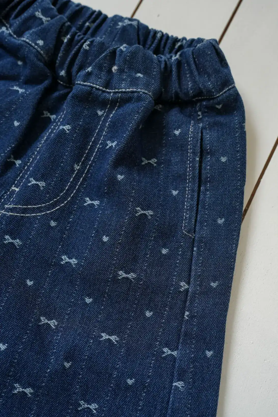 Bow Denim Jeans for girls with delicate bow print and ruffled cuffs