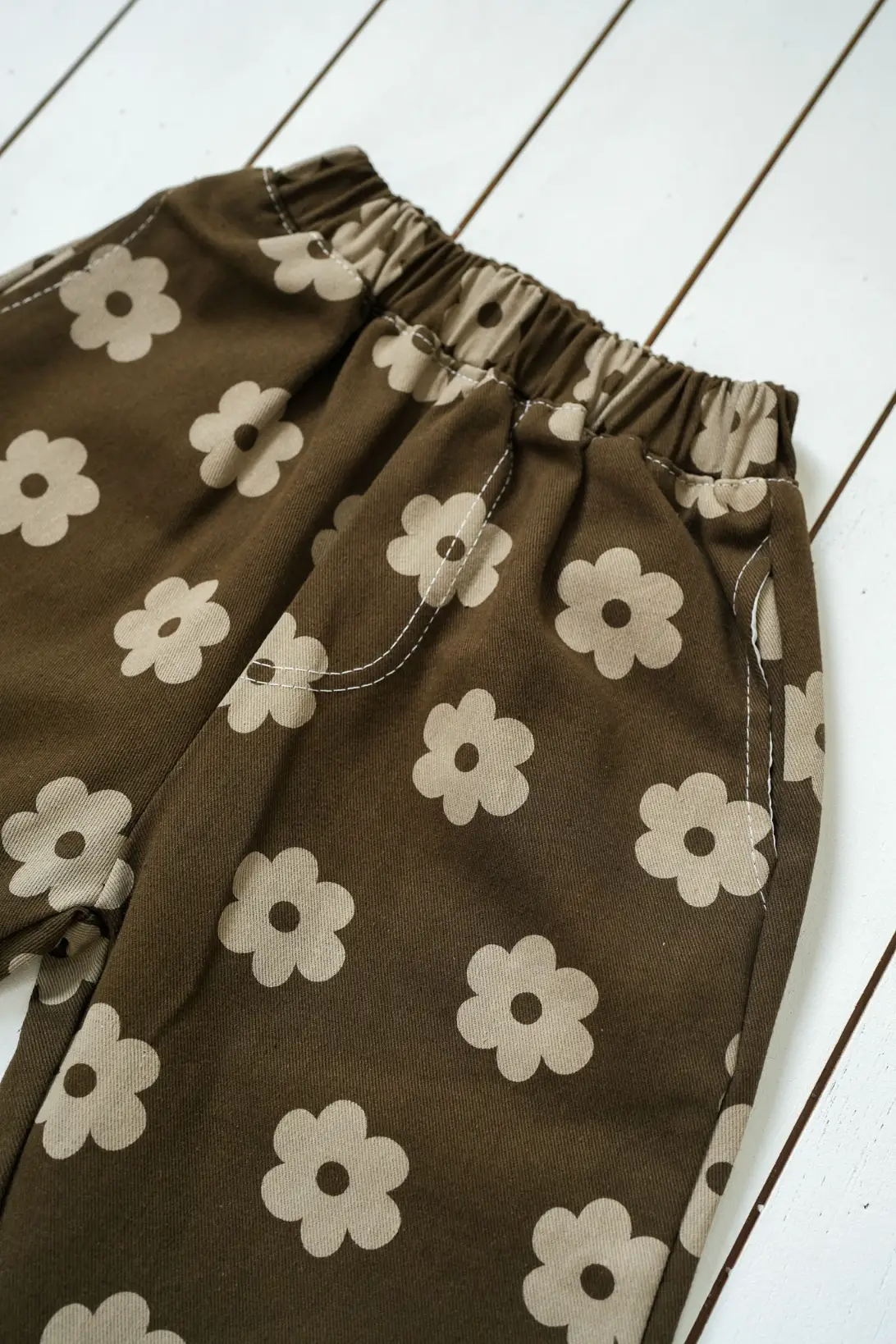 Brown Daisy Pants for kids with beige floral print and elasticated waist
