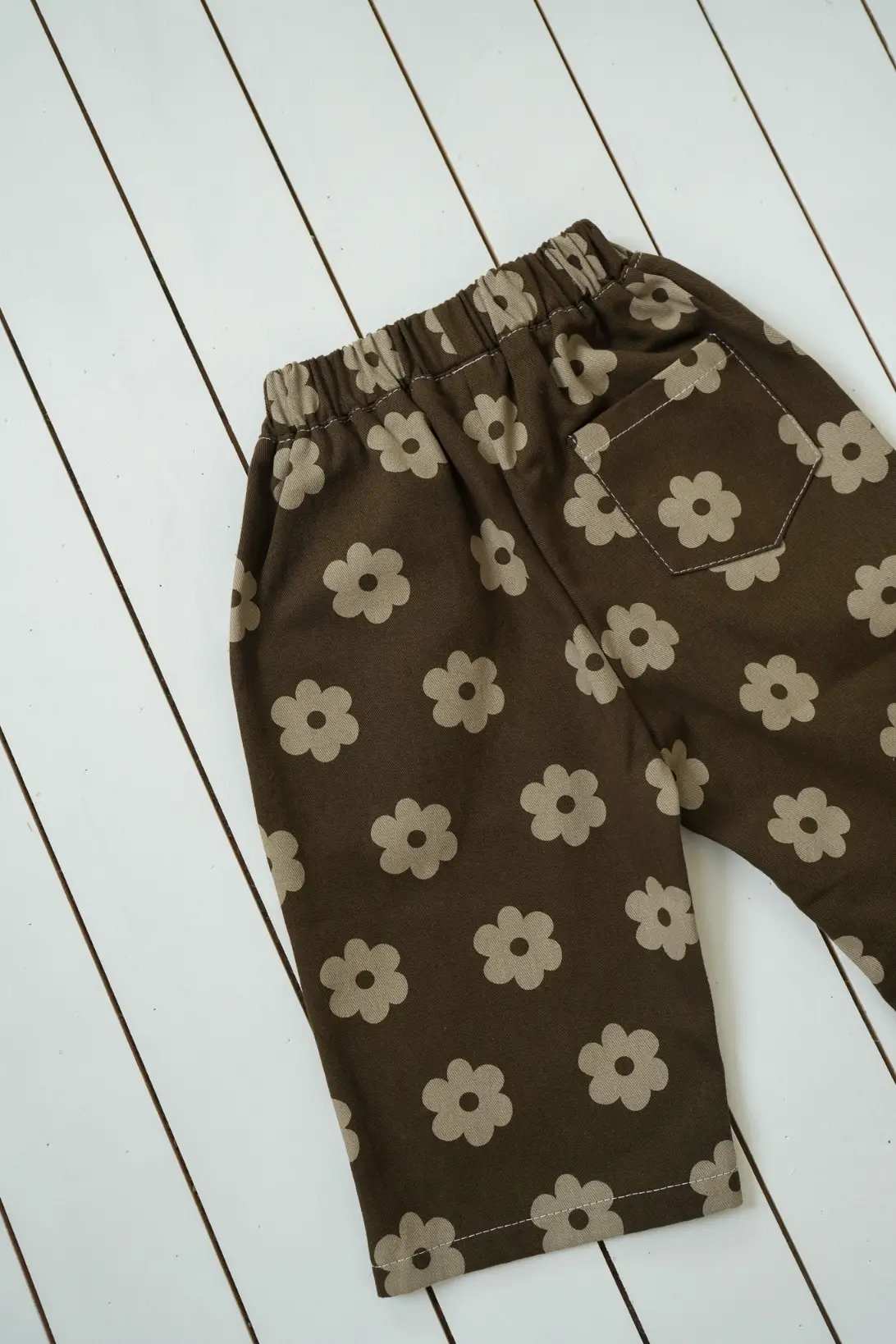 Brown Daisy Pants for kids with beige floral print and elasticated waist