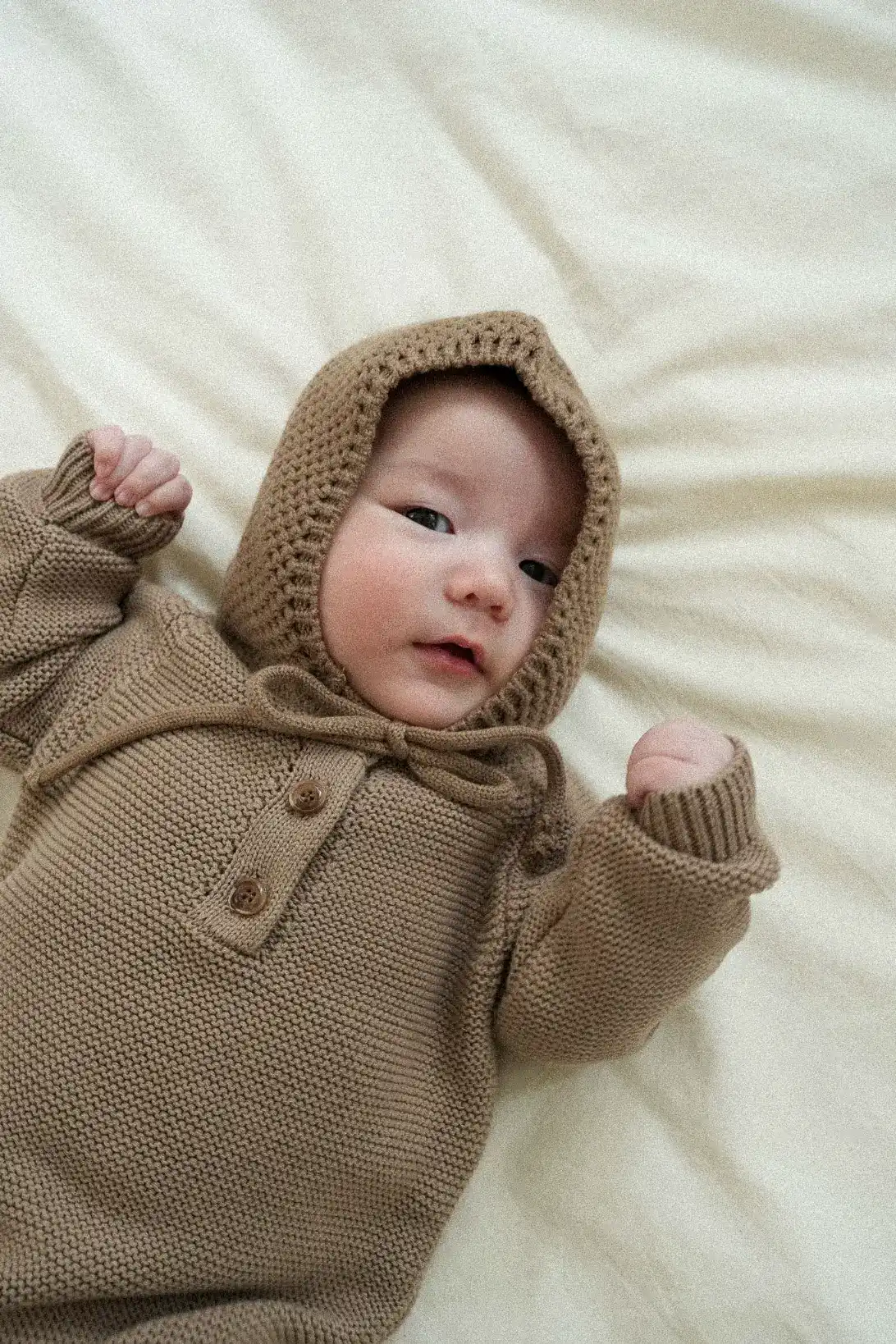Little Nest 100% cotton knitted baby bodysuit brown Soft textured knit detail of brown baby bonnet