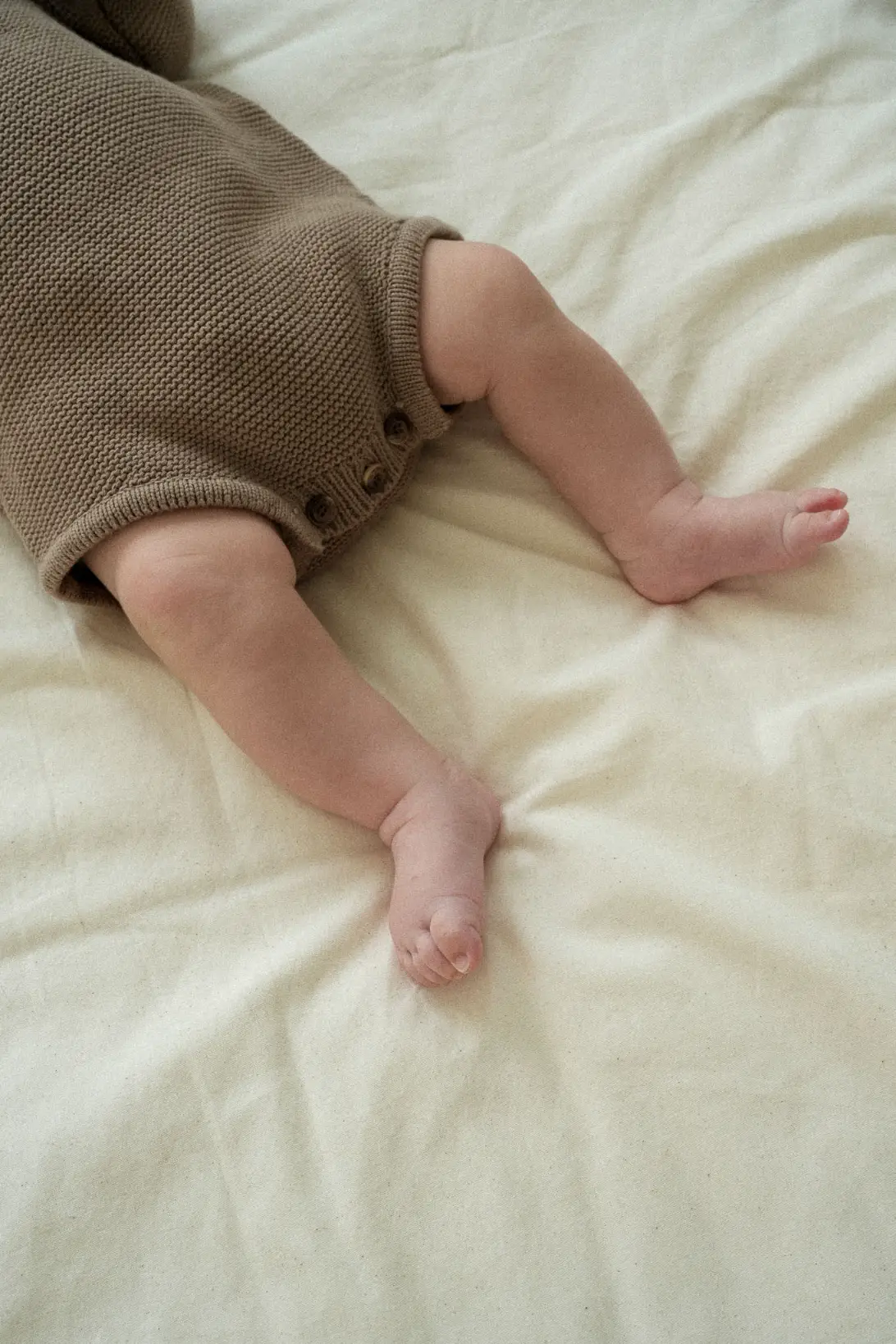 Little Nest 100% cotton knitted baby bodysuit in neutral colours