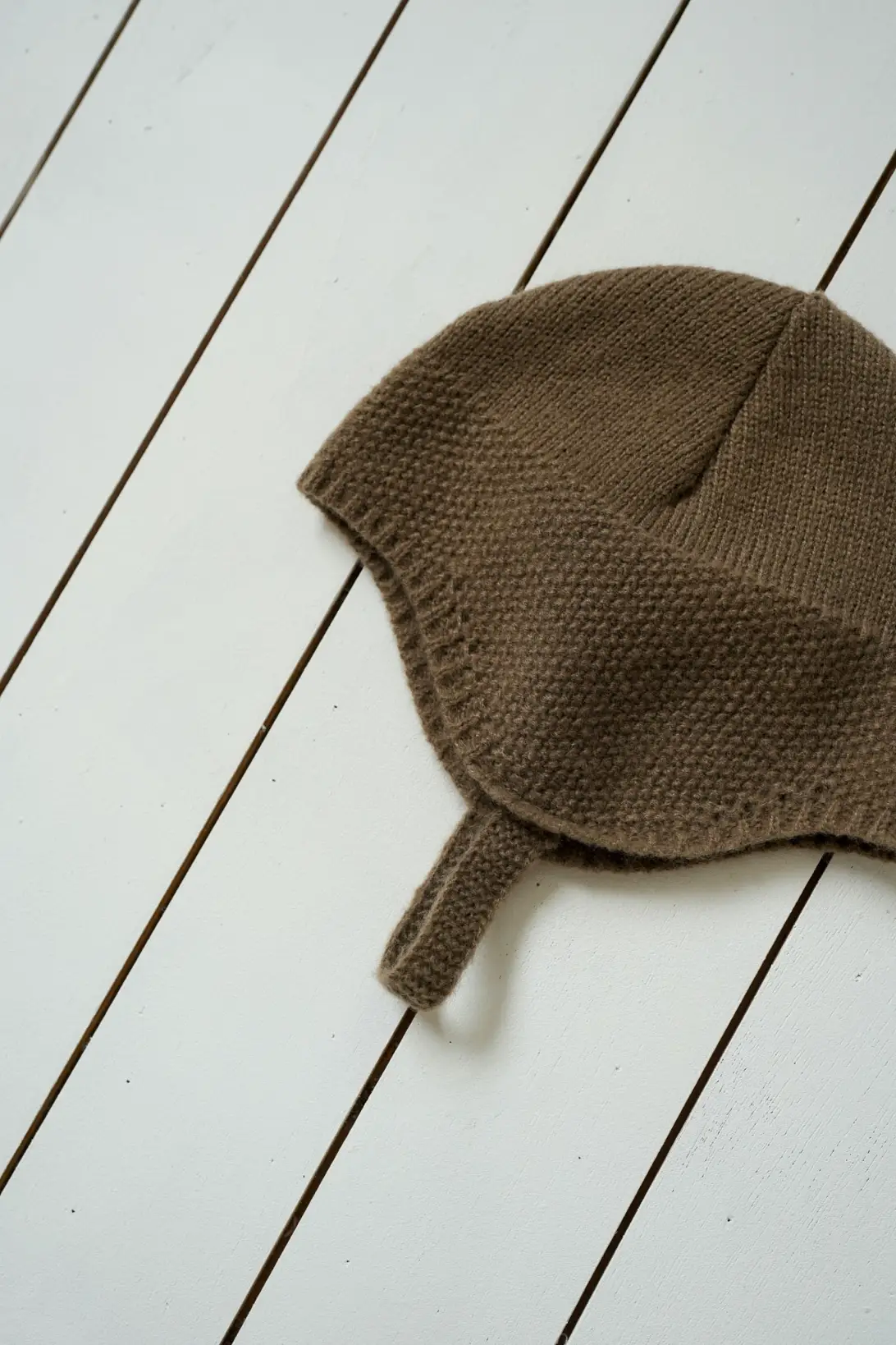 Brown Little Explorer baby knit hat with button fastening