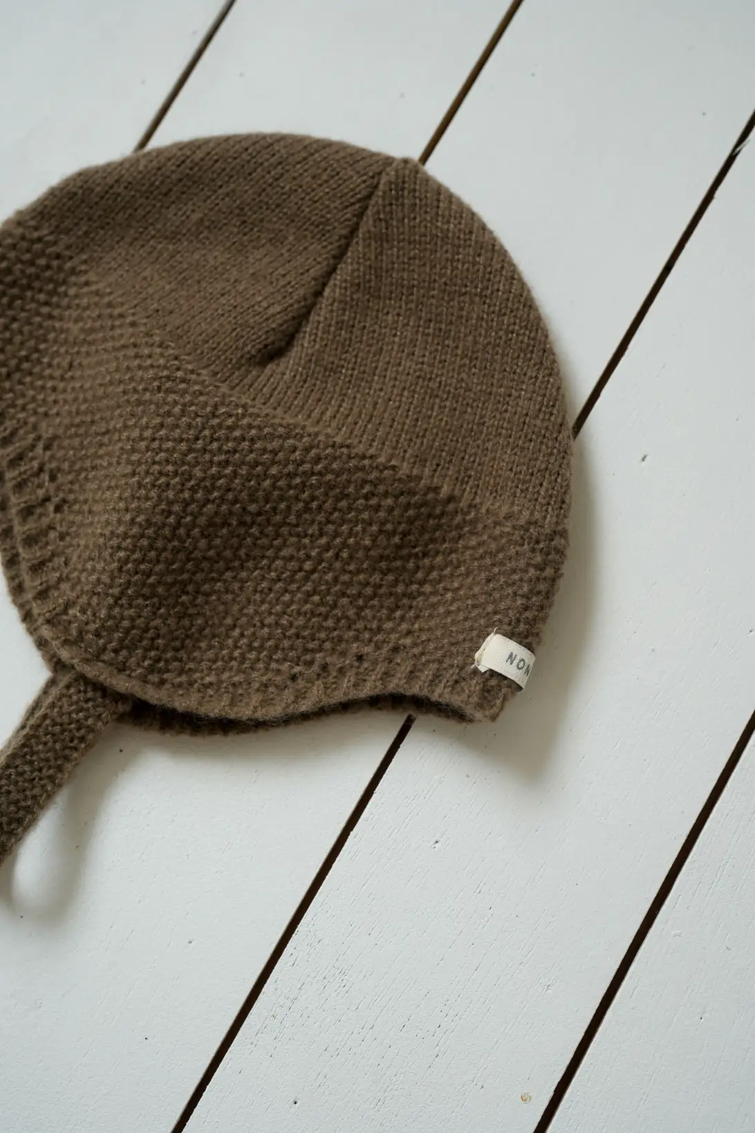 Brown Little Explorer baby knit hat with button fastening