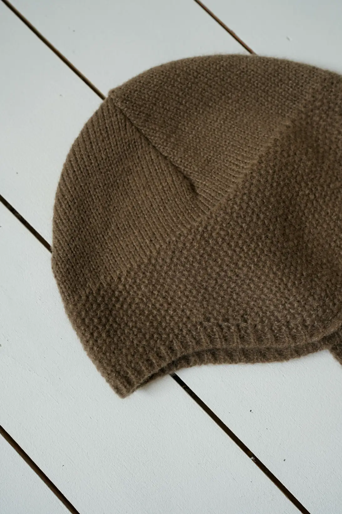 Brown Little Explorer baby knit hat with button fastening