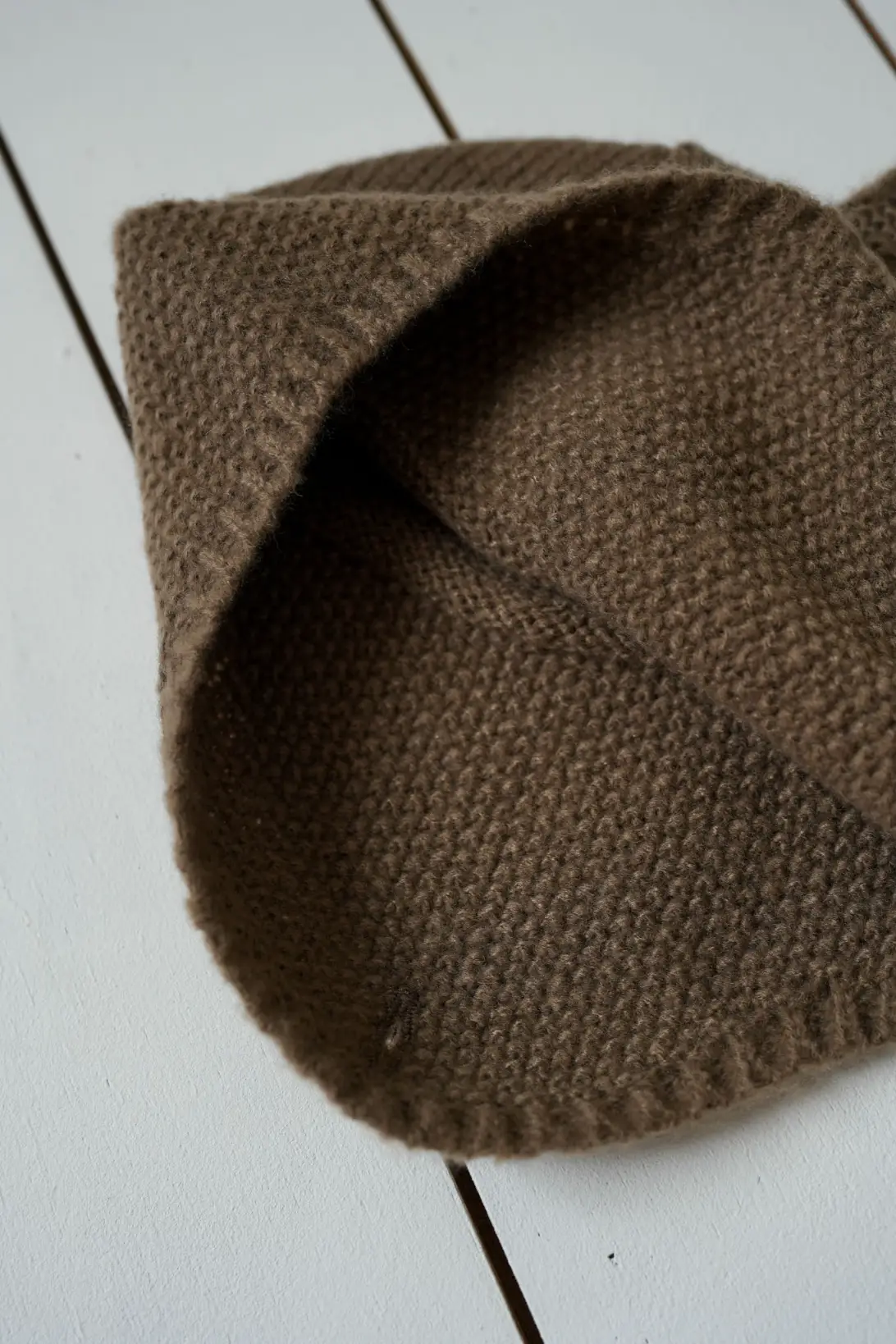 Soft knit texture of brown Little Explorer baby hat