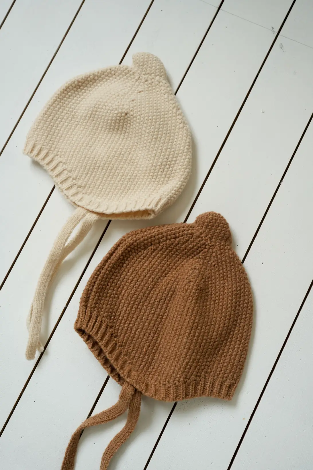Cream and brown Acorn baby knit bonnets with tie straps