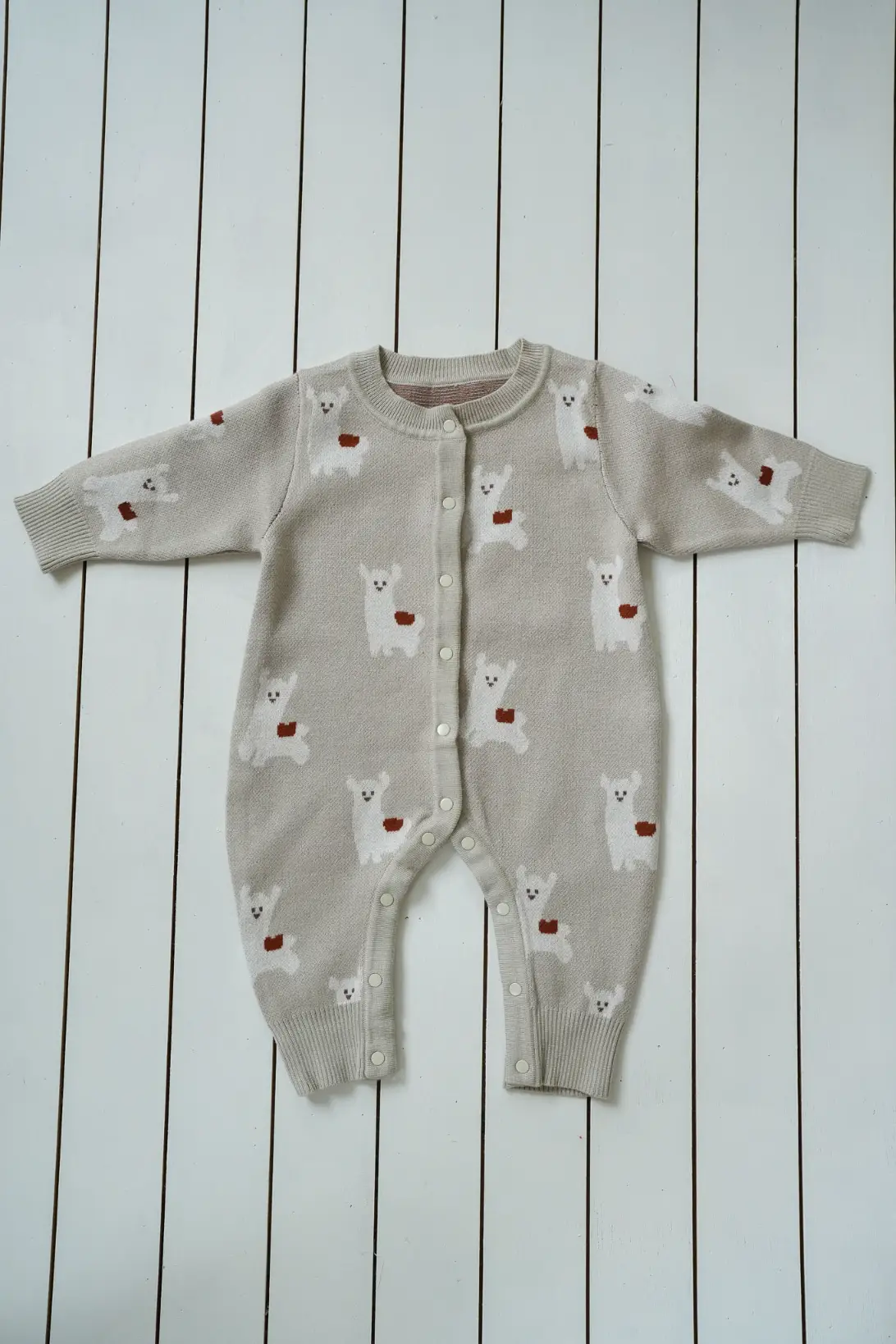 Soft knitted baby romper