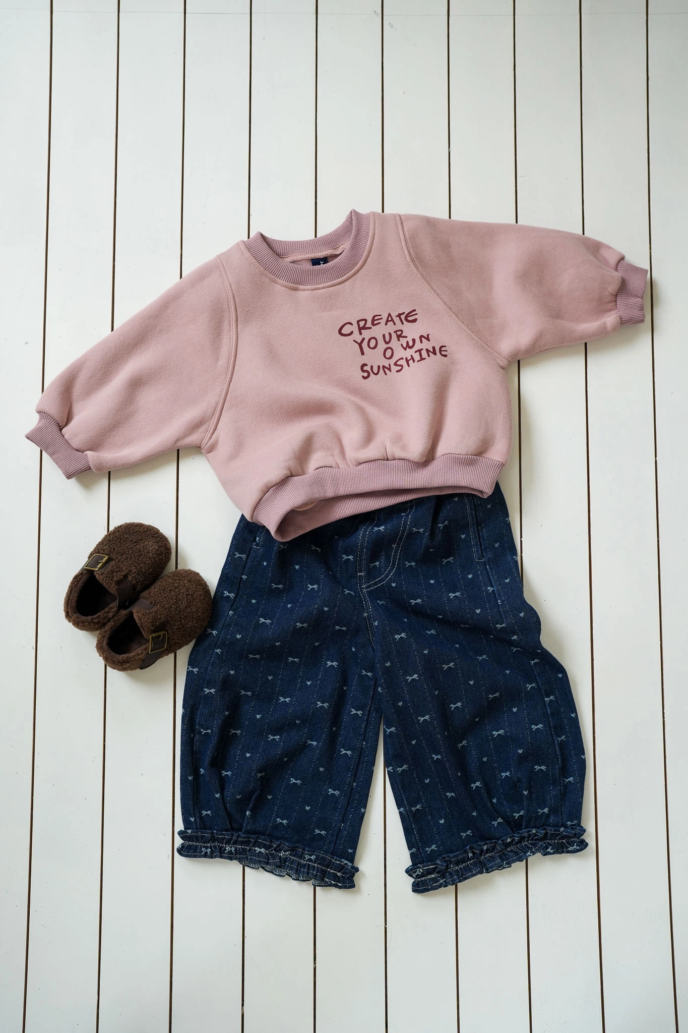 Bow Denim Jeans for girls with delicate bow print and ruffled cuffs
