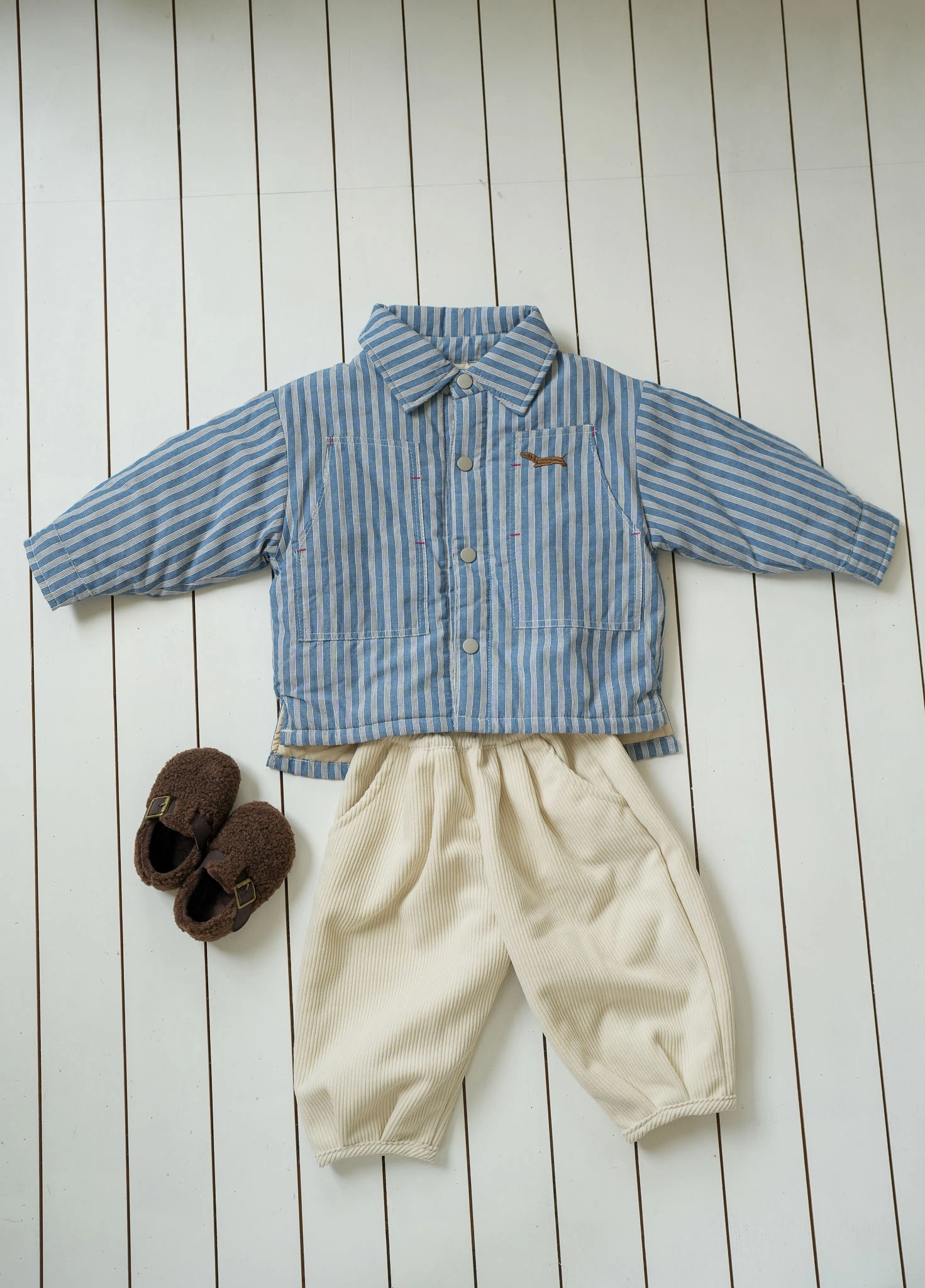 Cream corduroy kids pants with elasticated waist and relaxed fit